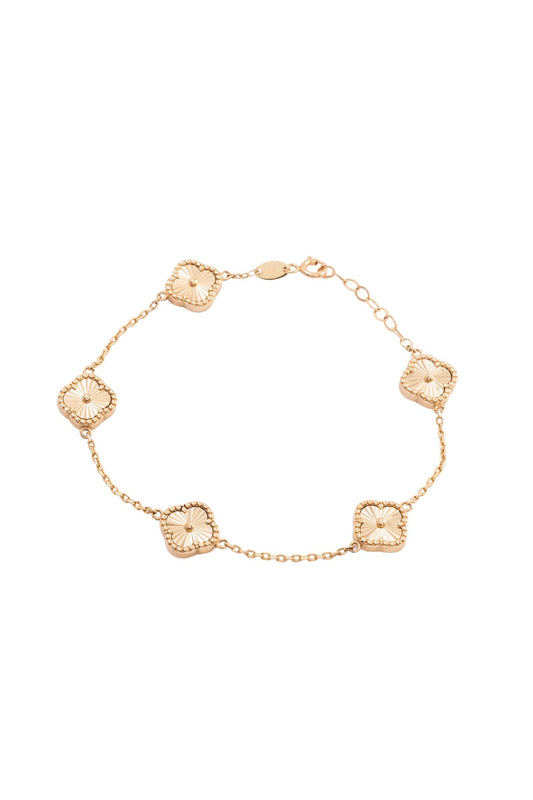 Pulsera 10 kilates con flores de cuatro pétalos diamantados..png