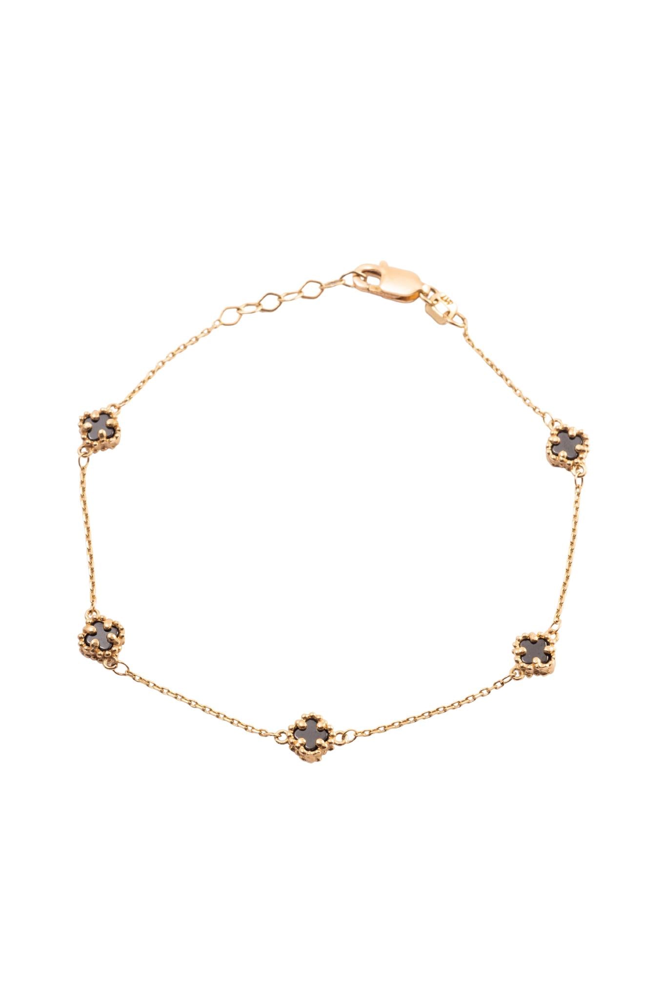 Pulsera 10 kilates con flores minis de cuatro pétalos negros..png