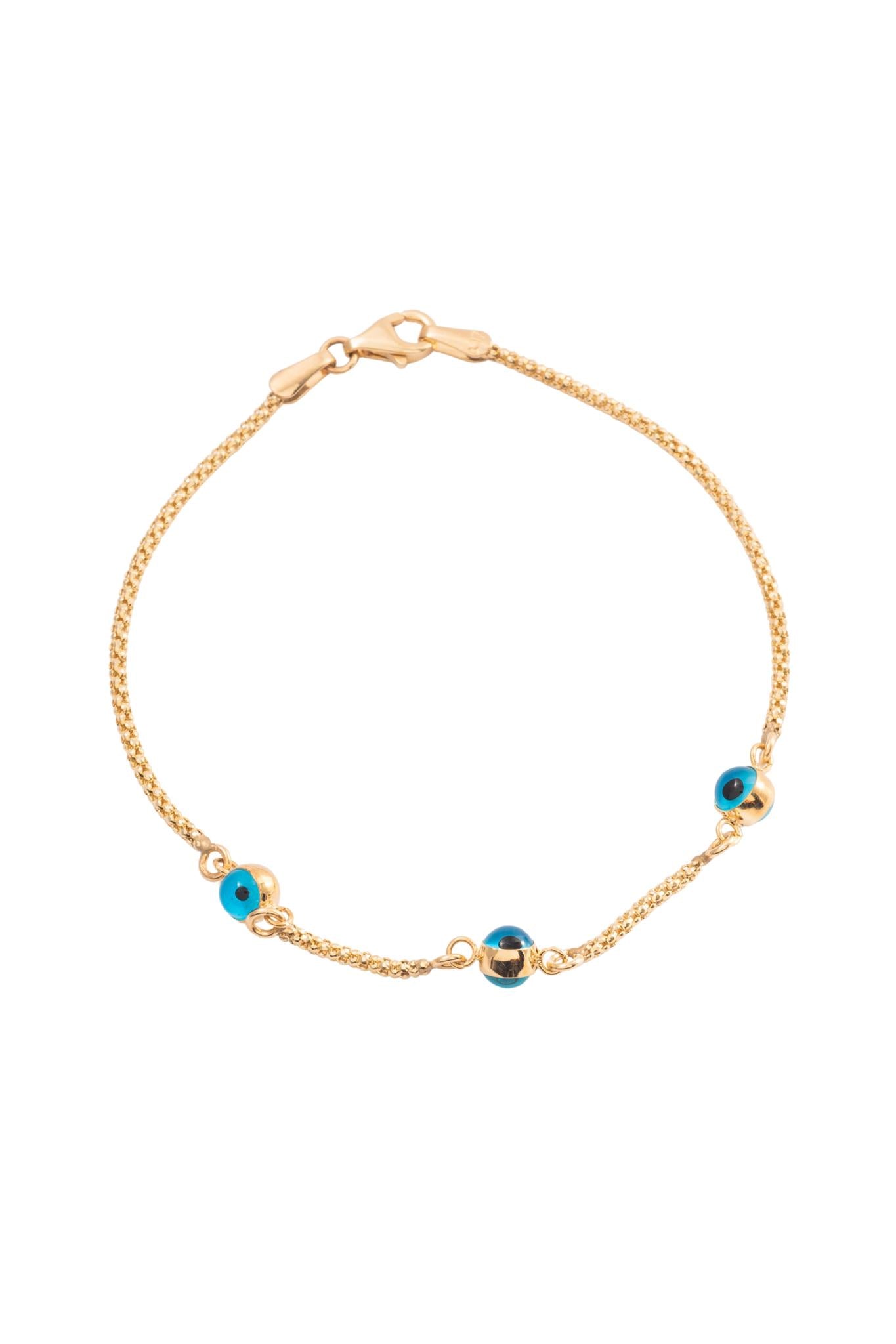 Pulsera 10 kilates con tres ojos azules saltones biselados..png