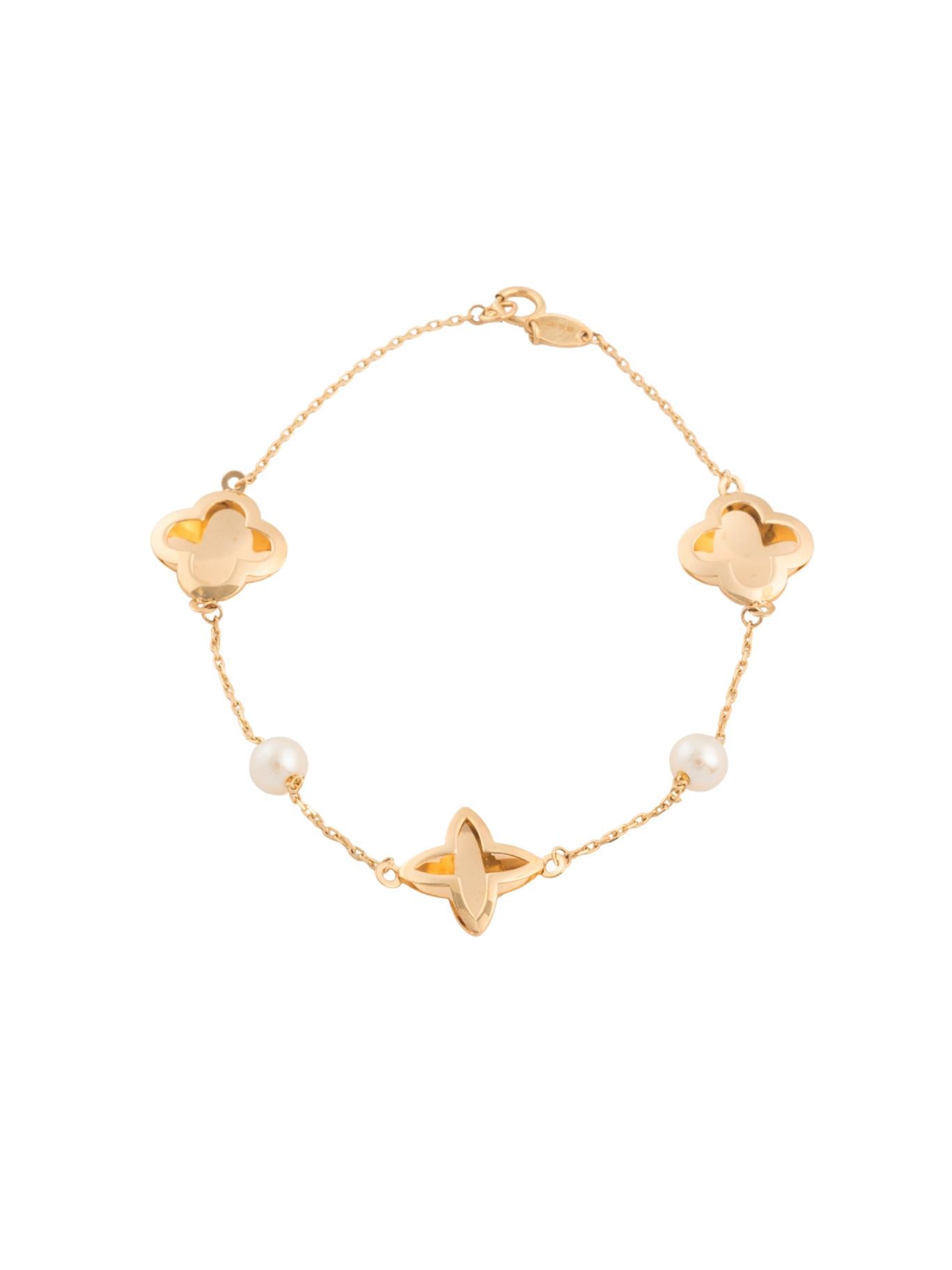 Pulsera 10 kilates flores de cuatro pétalos 3D contorno y flor de picos con perlas.png