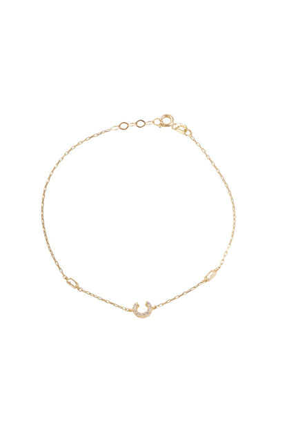 Pulsera 10 kilates, inicial "C" de zirconias y laterales con dos zirconias rectangulares biseladas..png