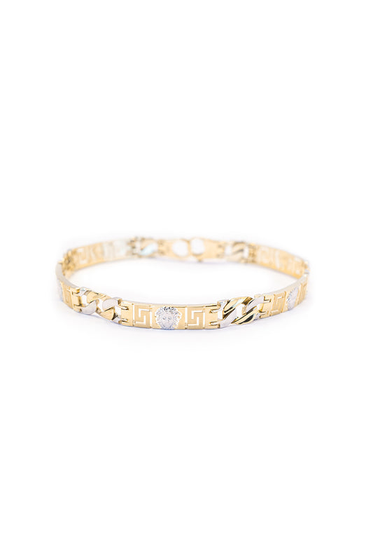 Pulsera 14 kilates con cabeza de medusa en oro blanco y eslabones cubanos oro amarillo y oro blanco intercalados..png