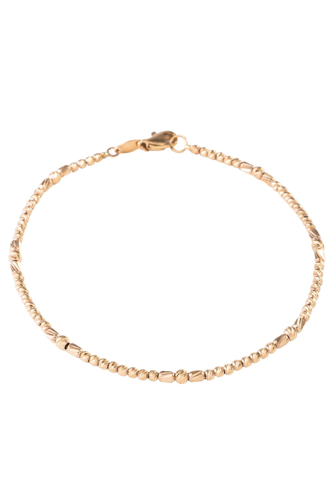 Pulsera de oro sólido en 10 kilates con bolas pegadas diamantadas chicas y grandes..png