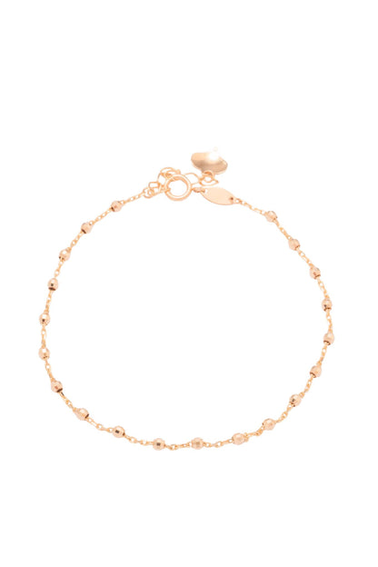 Pulsera de oro sólido en 10 kilates con bolitas chicas en estilo diamantado y al finalizar un corazón .png