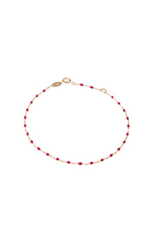 Pulsera de oro sólido en 10 kilates con bolitas esmaltadas rosa fucsia..png