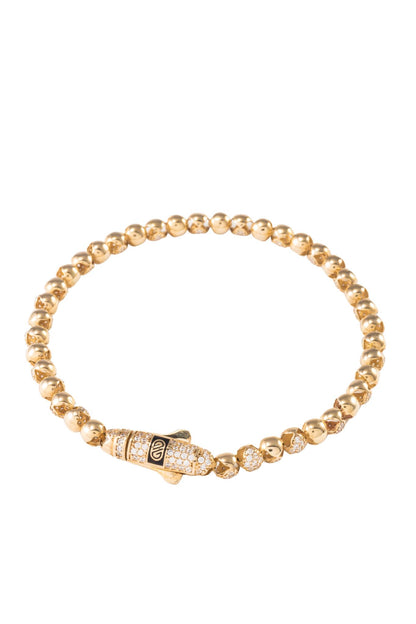 Pulsera de oro sólido en 10 kilates con dijes de bolas huecas lisas y zirconias intercaladas..png