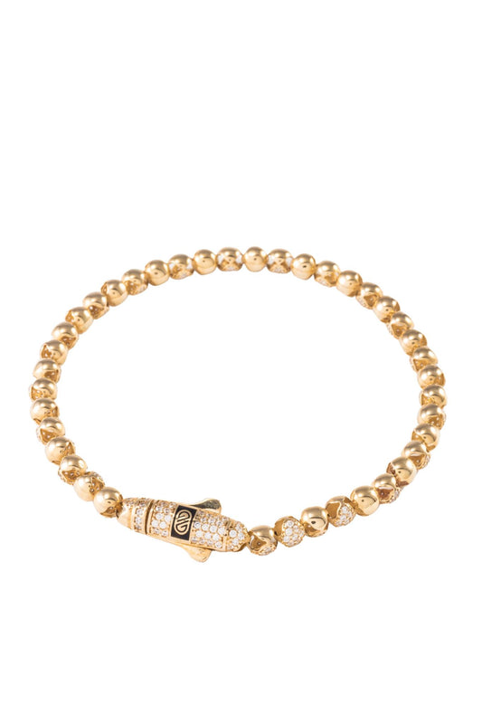 Pulsera de oro sólido en 10 kilates con dijes de bolas huecas lisas y zirconias intercaladas..png