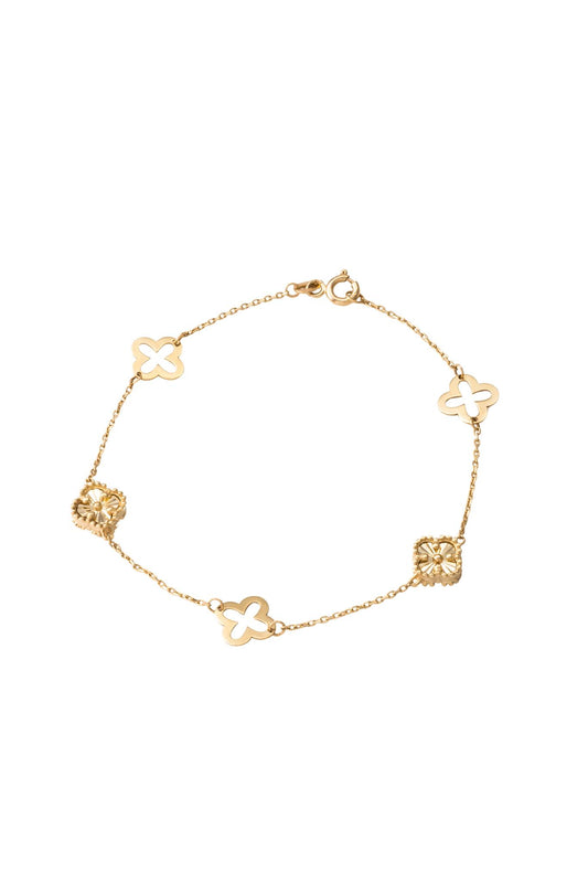 Pulsera de oro sólido en 10 kilates con flores de cuatro pétalos diamantadas y hueca lisa intercaladas..png