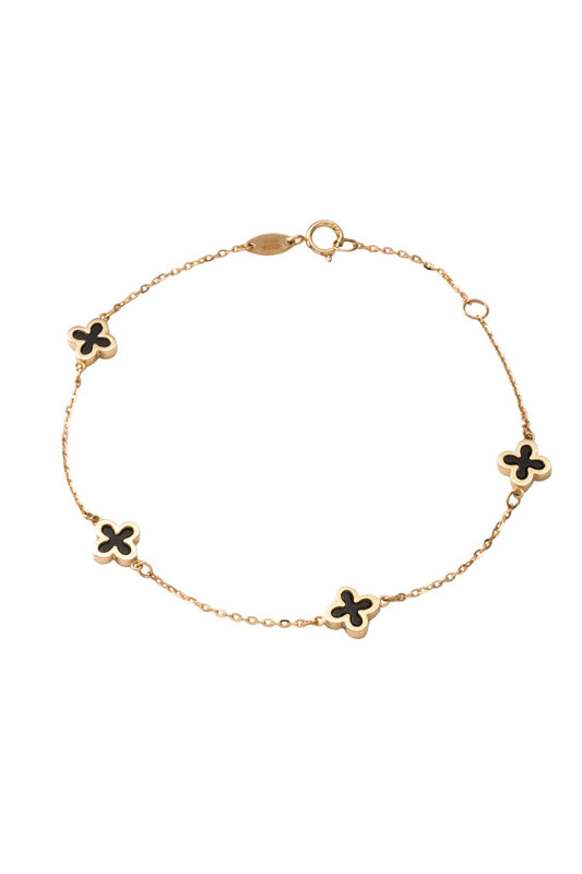Pulsera de oro sólido en 10 kilates con flores de cuatro pétalos negros onix y bisel liso..png