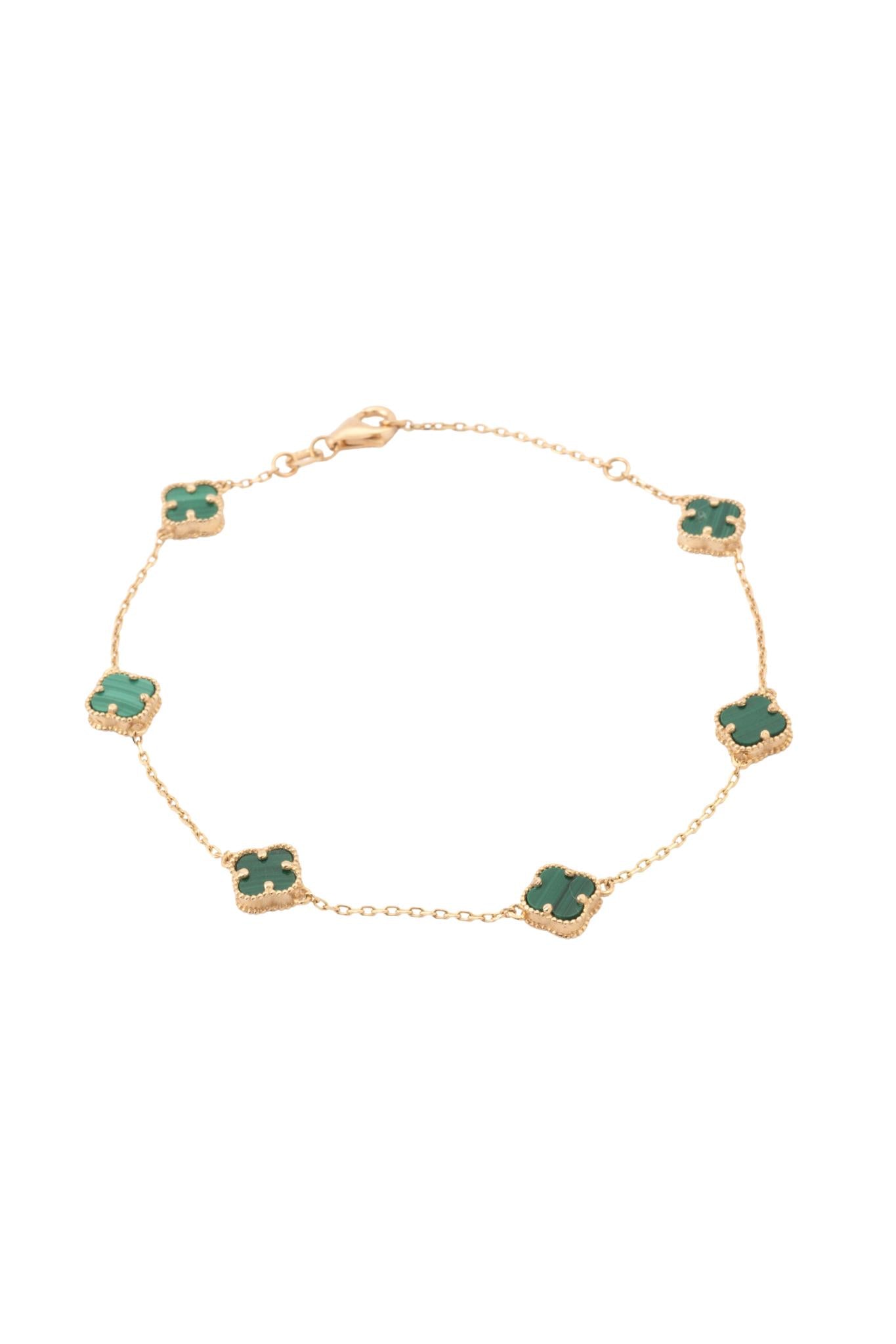 Pulsera de oro sólido en 10 kilates con flores de cuatro pétalos verdes..png