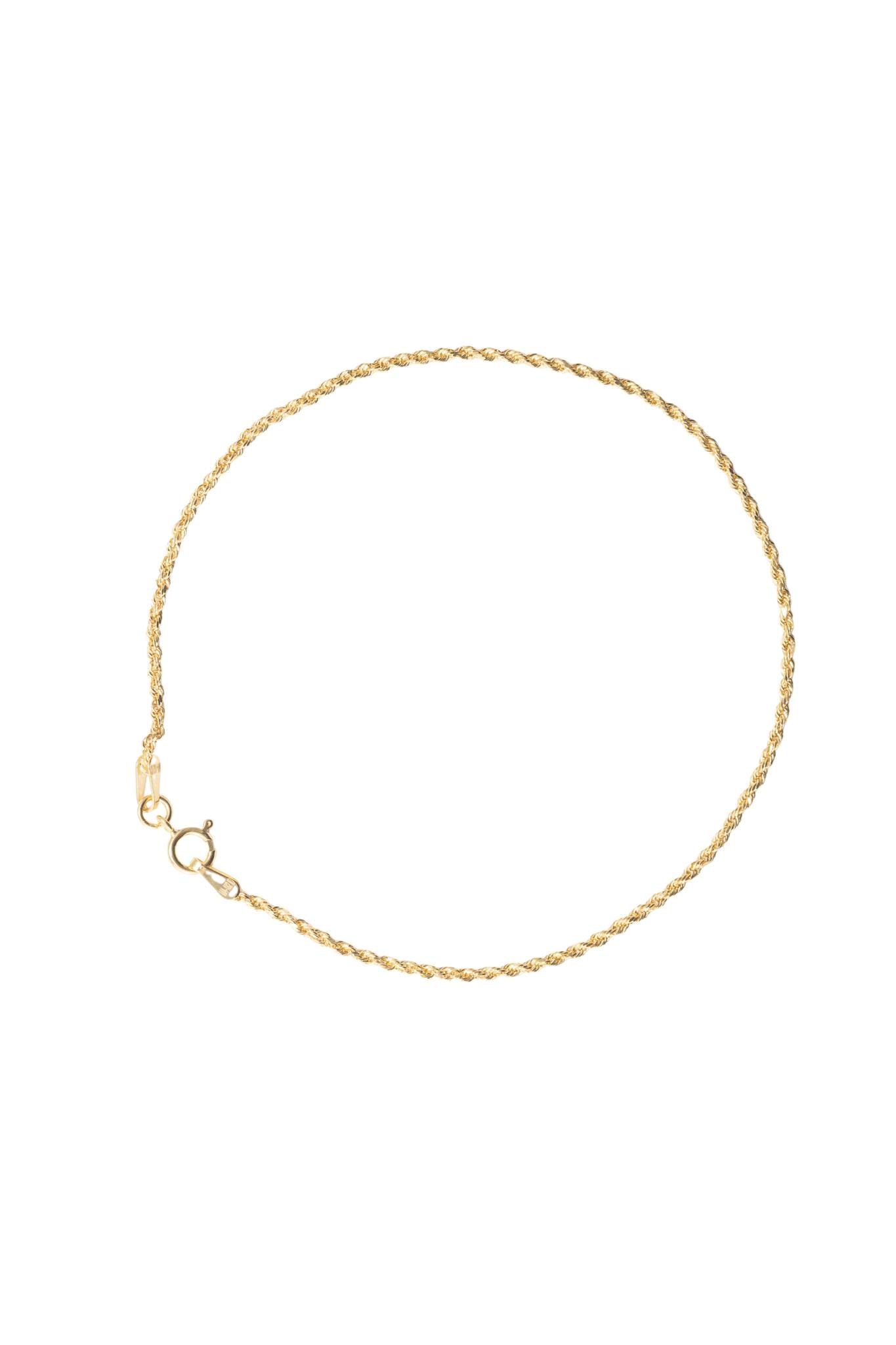 Pulsera de oro solido en 10 kilates con un estilo de torzal delgado .png