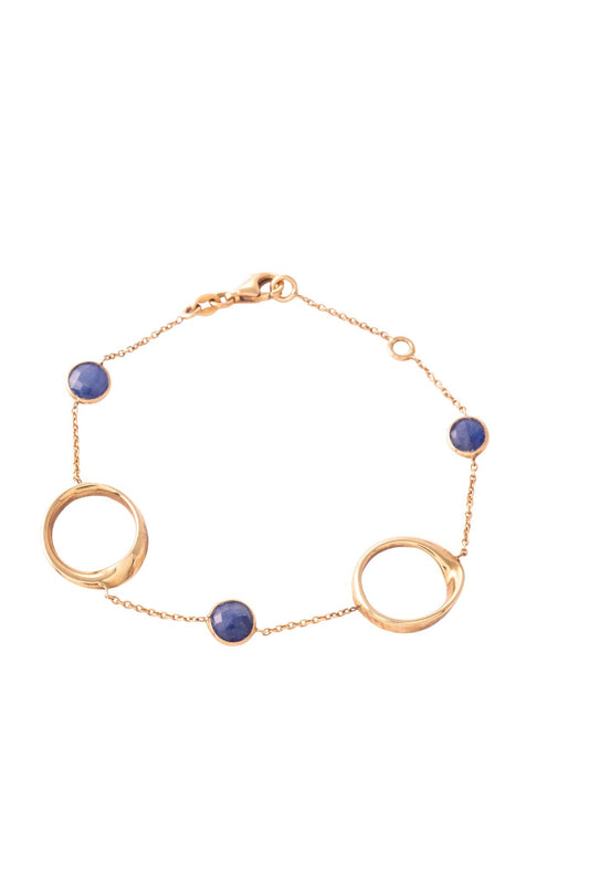 Pulsera de oro sólido en 14 kilates con círculos desiguales en oro amarillo y piedras preciosas biseladas..png