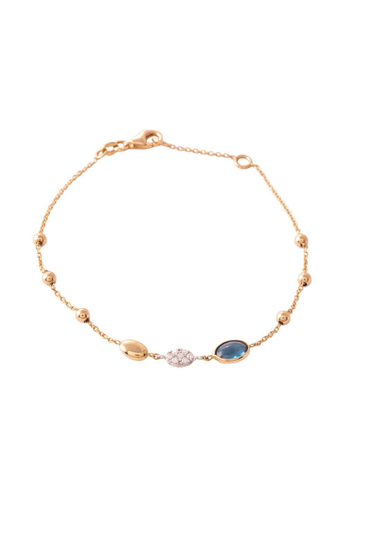 Pulsera de oro sólido en 14 kilates con piedra iolita, semilla de diamantes de 0.14 ct montados en oro blanco y detalles de bolitas lisas en oro amarillo..png