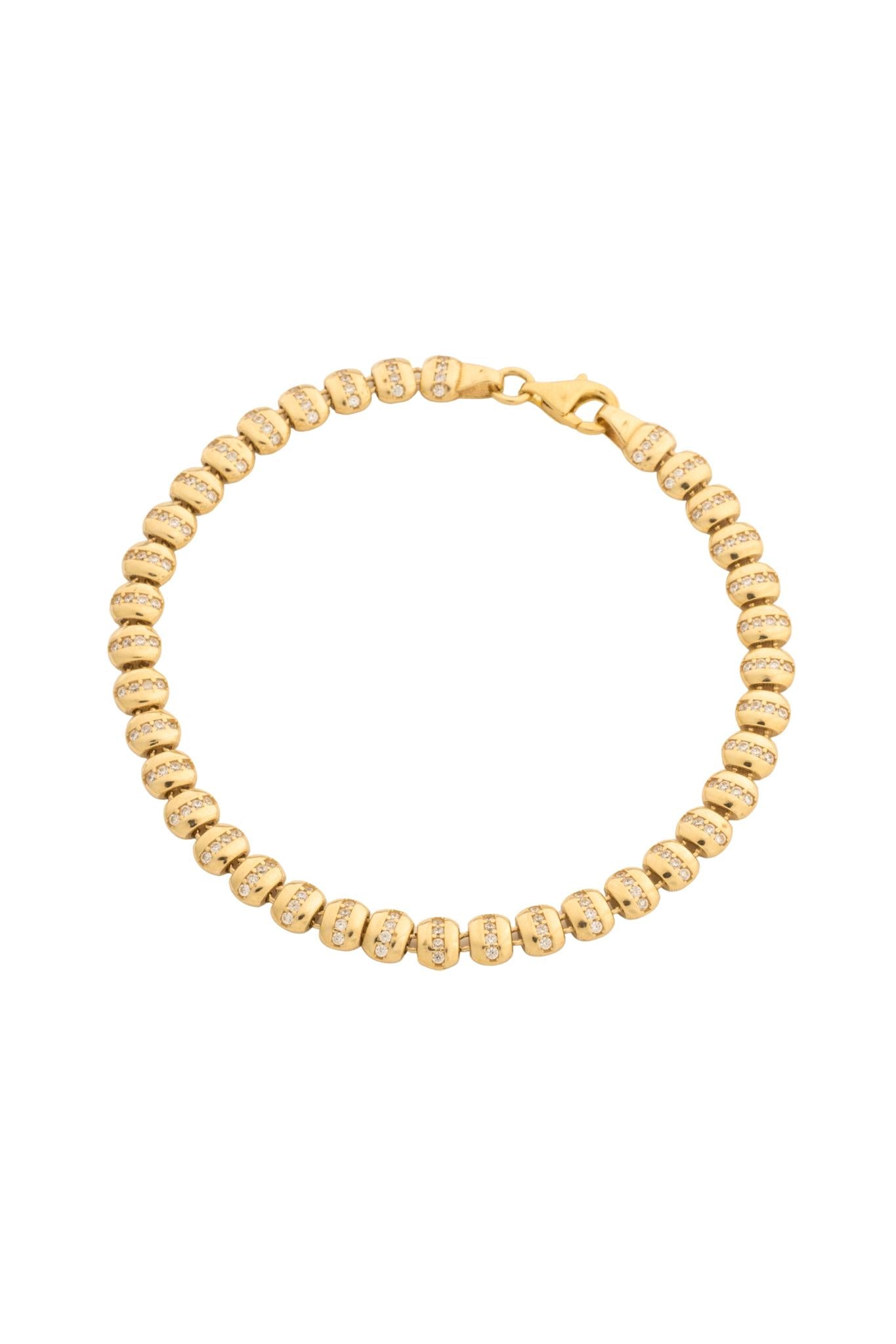 Pulsera en 10 kilates con bolas lisas y zirconias.png
