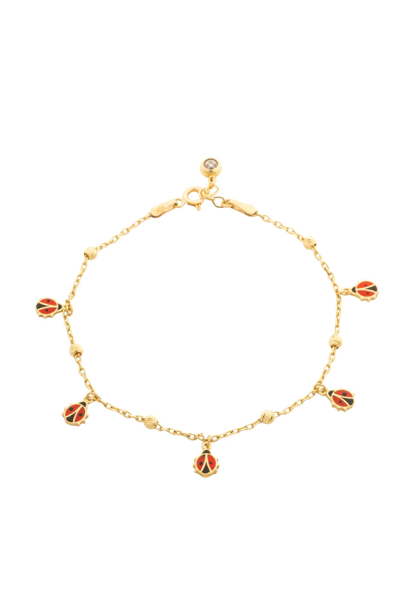Pulsera en 10 kilates con bolitas diamantadas y catarinas.png