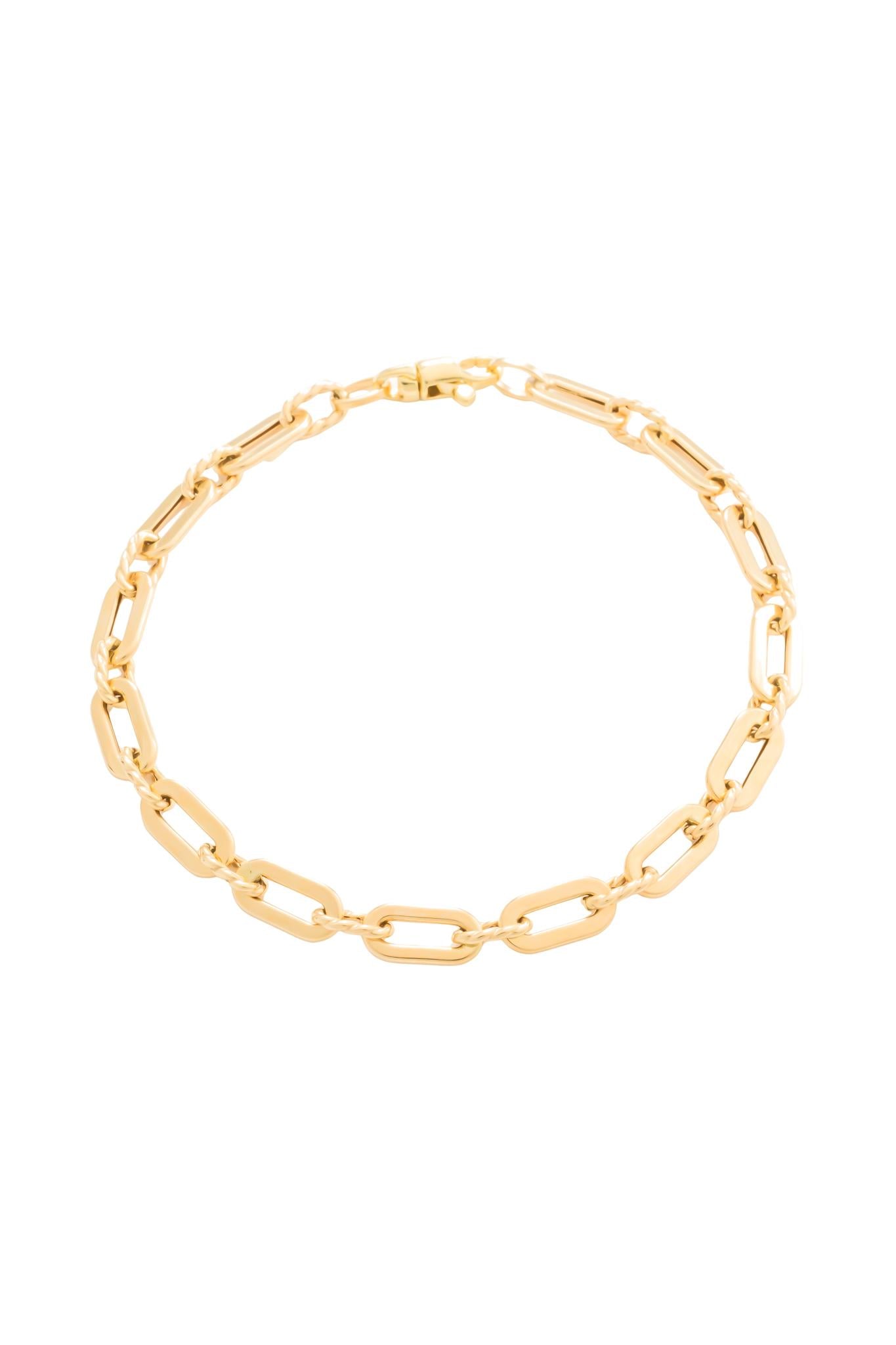 Pulsera en 10 kilates con eslabón ovalado liso y cuerda.png