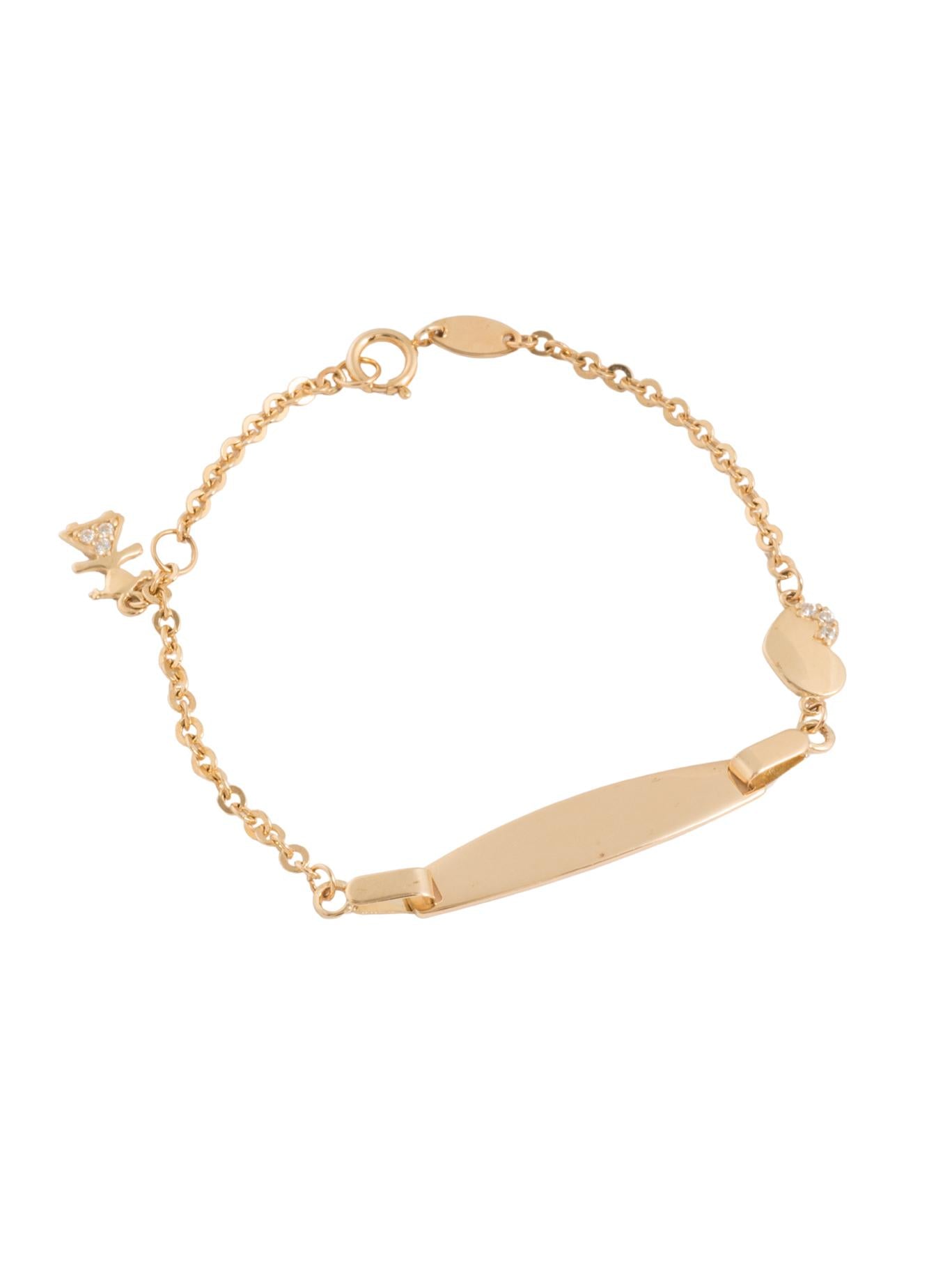 Pulsera esclava 10 kilates placa en forma de semilla y corazones lisos y orilla zirconias.png