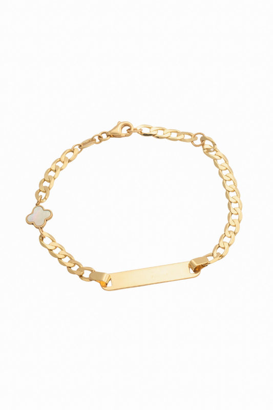 Pulsera esclava de oro sólido en 10 kilates con placa lisa al centro y flor de cuatro pétalos madre perla..png