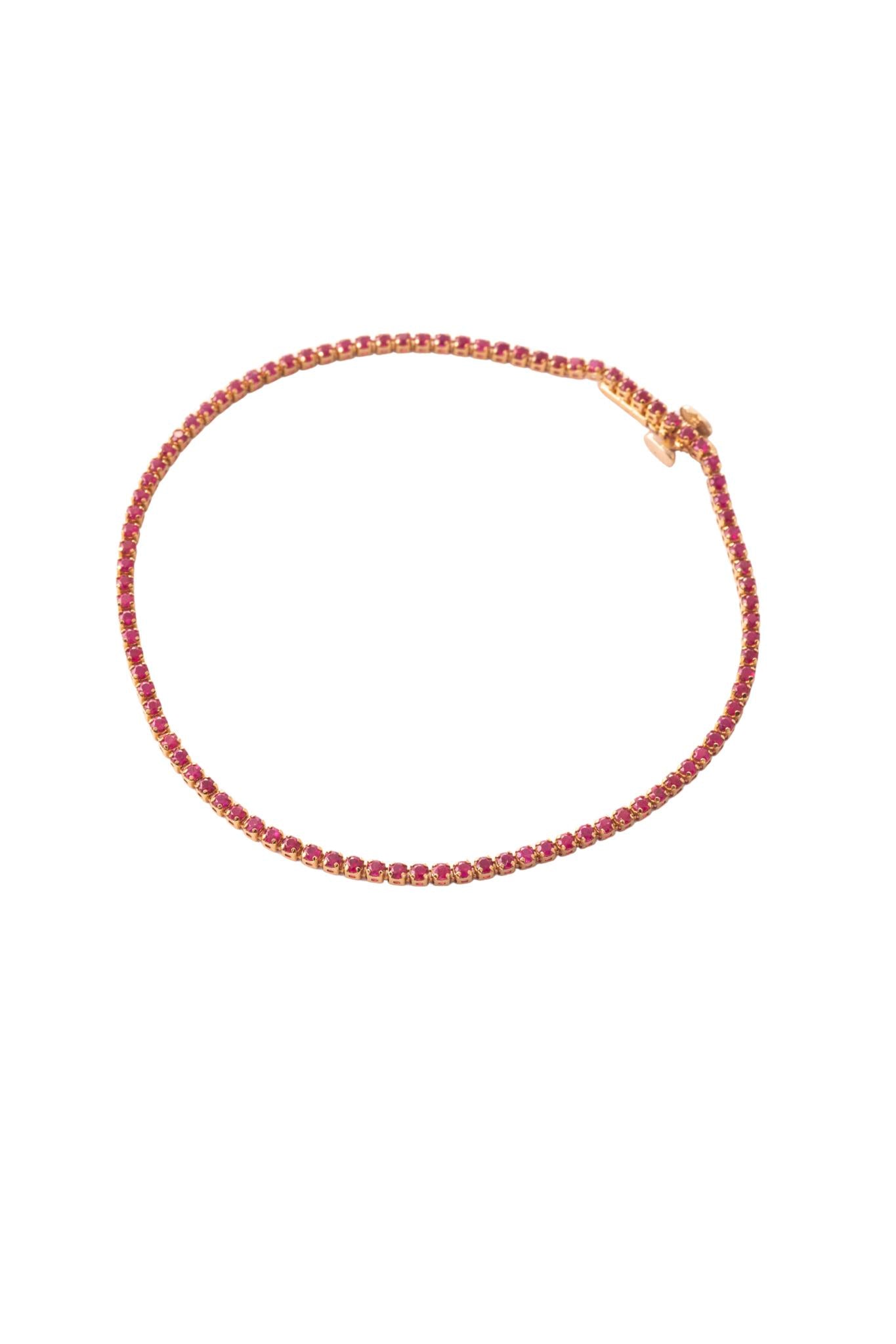 Pulsera tenis de oro sólido en 14 kilates con rubies de 1.50 montados sobre oro amarillo..png