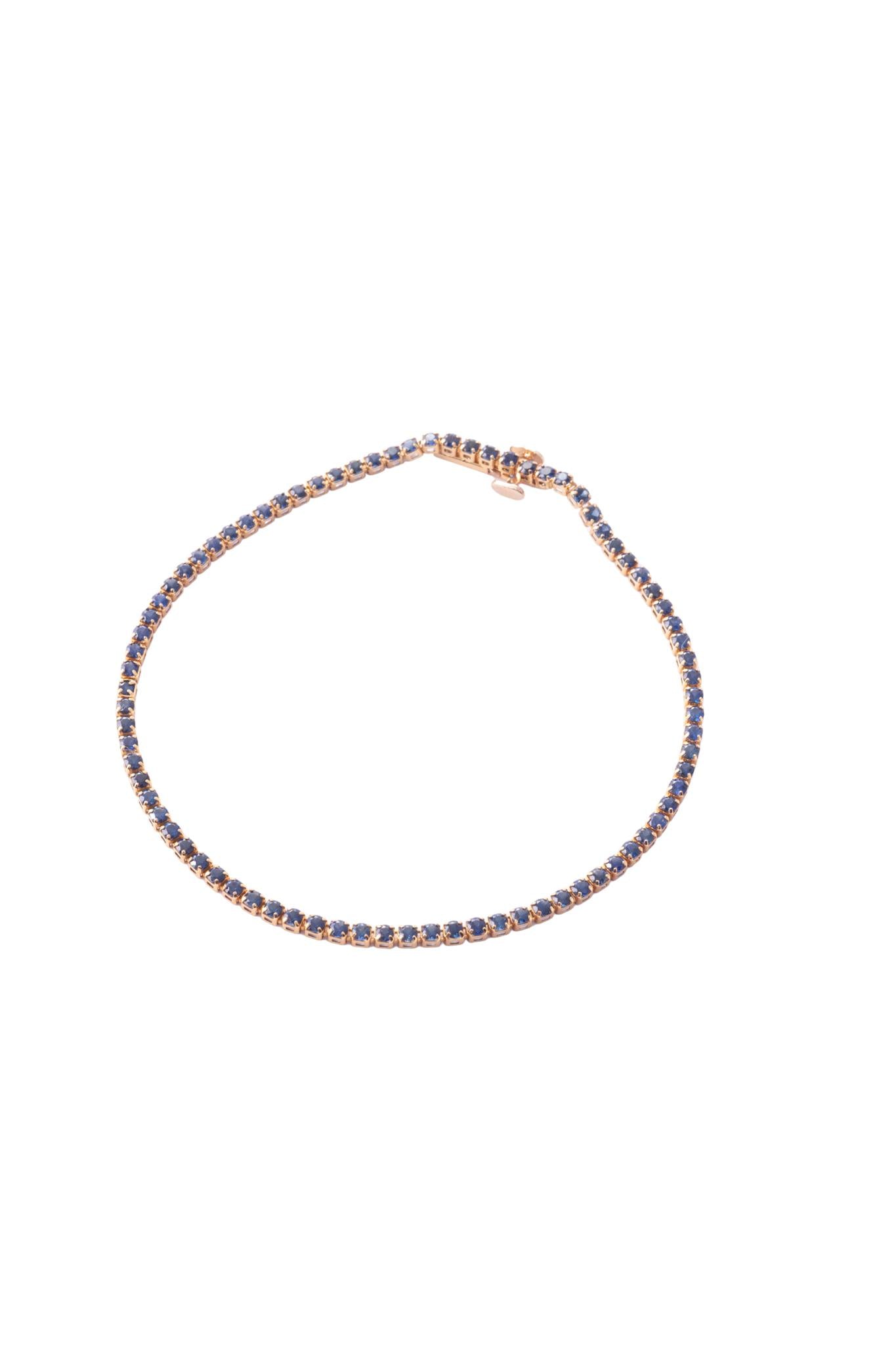 Pulsera tenis de oro sólido en 14 kilates con zafiros de 1.75 montados sobre oro amarillo..png