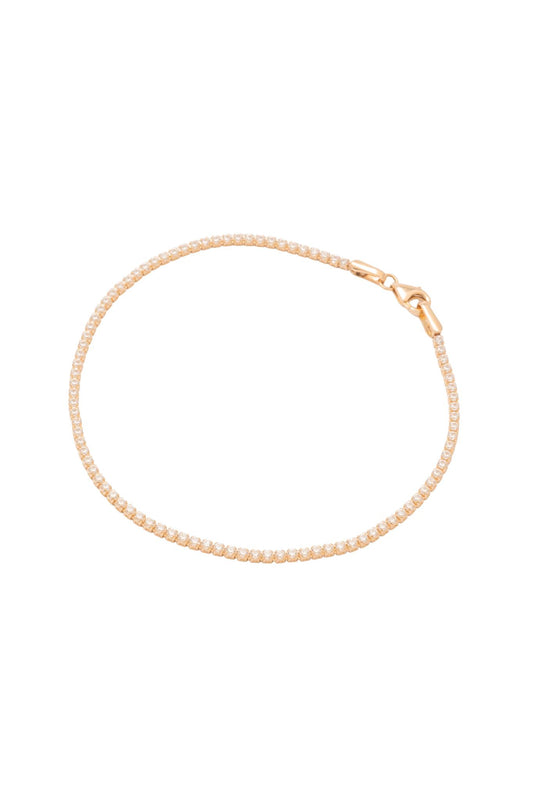 Pulsera tenis de oro sólido en 14 kilates con zirconias blancas montadas en oro amarillo..png