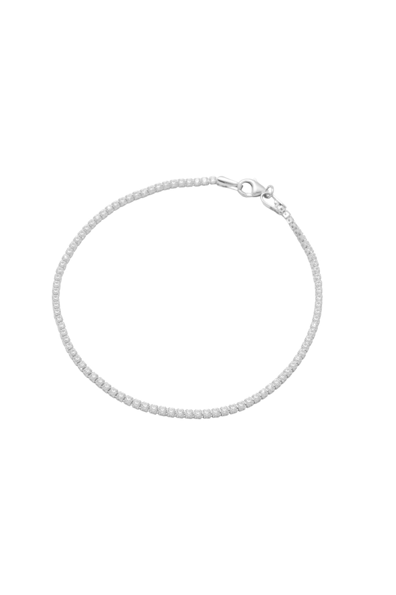 Pulsera tenis de oro sólido en 14 kilates con zirconias blancas montadas en oro blanco..png