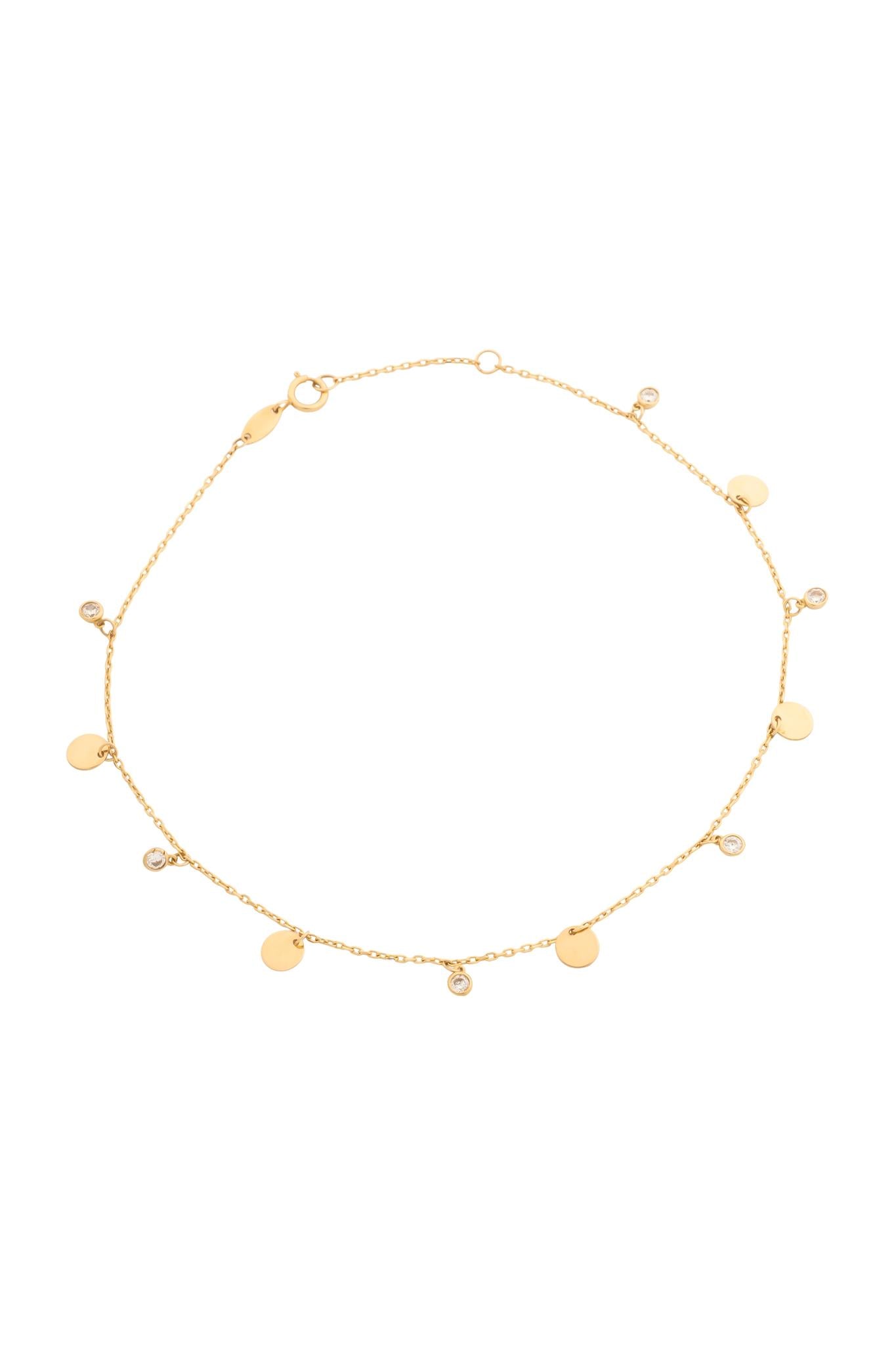 Tobillera en 10 kilates con zirconias diamantadas y círculos lisos.png